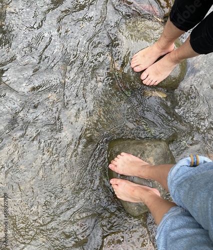 feet in the river