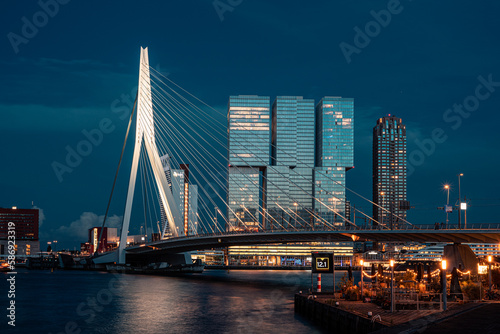 Erasmus bridge Rotterdam, bridge over river at sunset silhouette blue hour big city