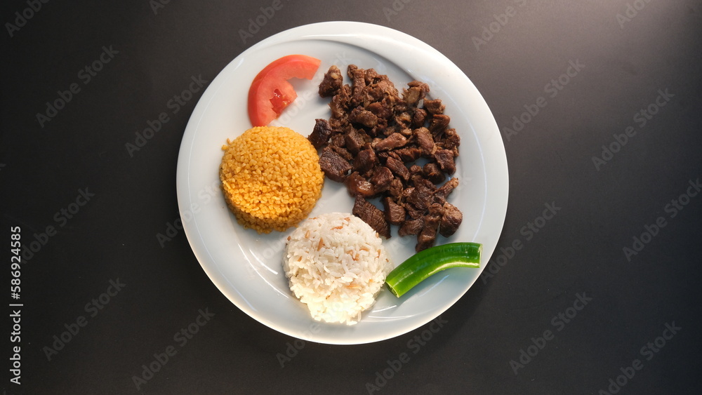 diced roasted meat served on a plate in the background diced roasted meat served on a plate in the background