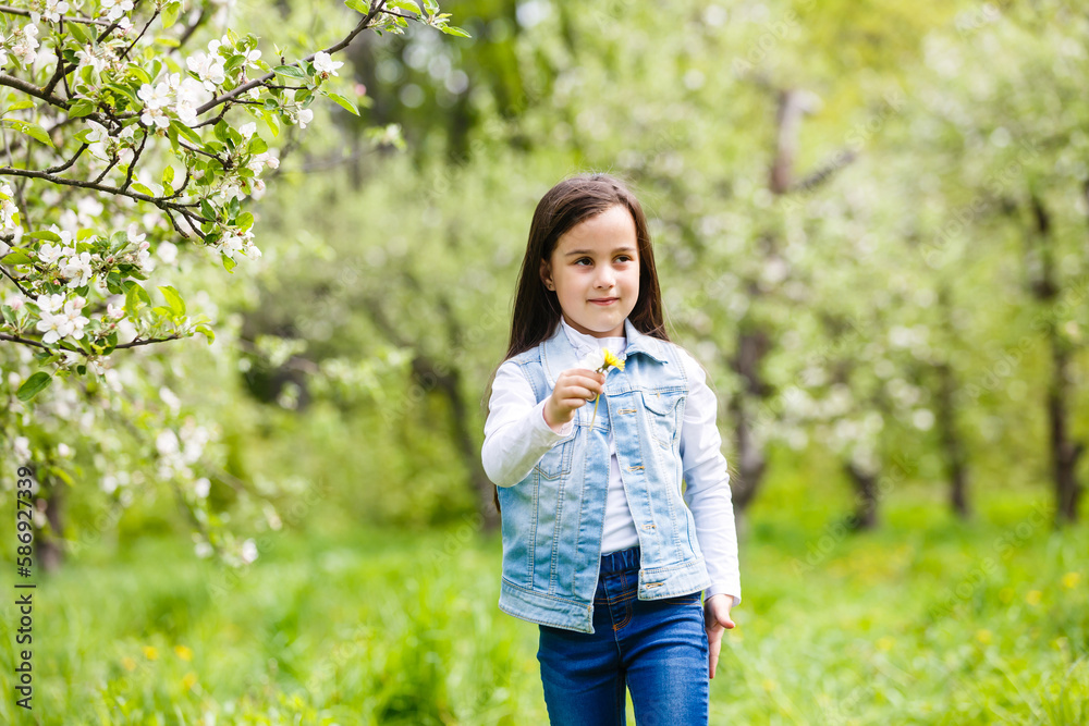 Portrait beautiful little girl near blossoming apple-tree. Portrait beautiful little girl near blossoming apple-tree.