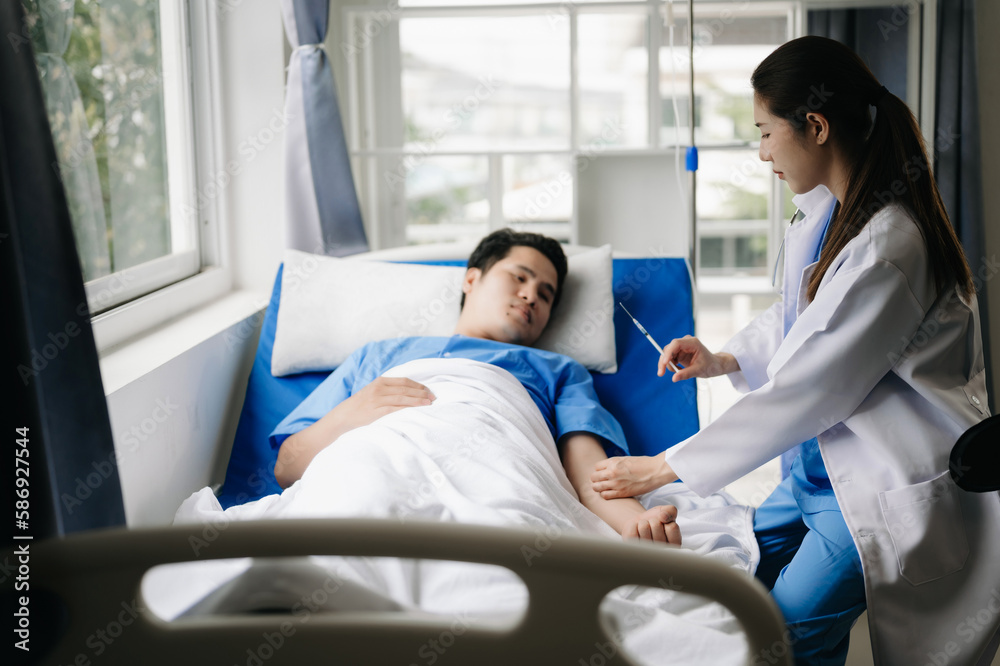 Doctor discussing treatment with male patient talking and laughing sitting on examination bed in clinic or hospital. Doctor discussing treatment with male patient talking and laughing sitting on examination bed in clinic or hospital.