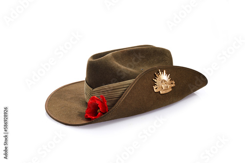 Anzac Day army slouch hat with red poppy isolated on white background. photo