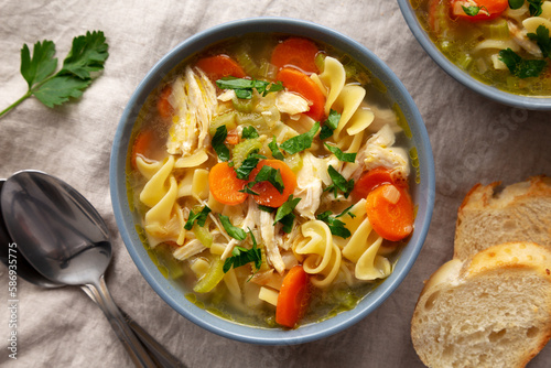 Homemade Chicken Noodle Soup in a Bowl, top view. Flat lay, overhead, from above.