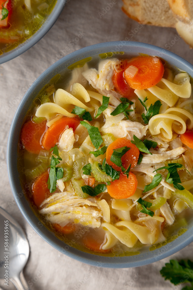 Homemade Chicken Noodle Soup in a Bowl, top view. Flat lay, overhead, from above.