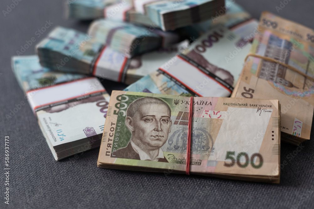 bundles of Ukrainian money, stacks of hryvnia, 200,500,1000 money concept. Lots of banknotes. Side view bundles of Ukrainian money, stacks of hryvnia, 200,500,1000 money concept. Lots of banknotes. Side view