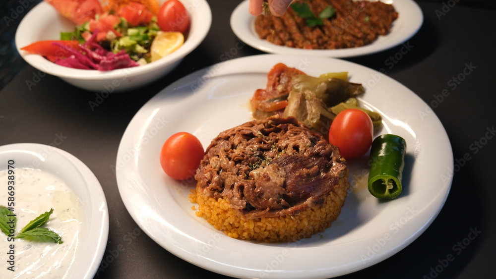 Stuffed lamb with appetizers on the presentation plate Stuffed lamb with appetizers on the presentation plate