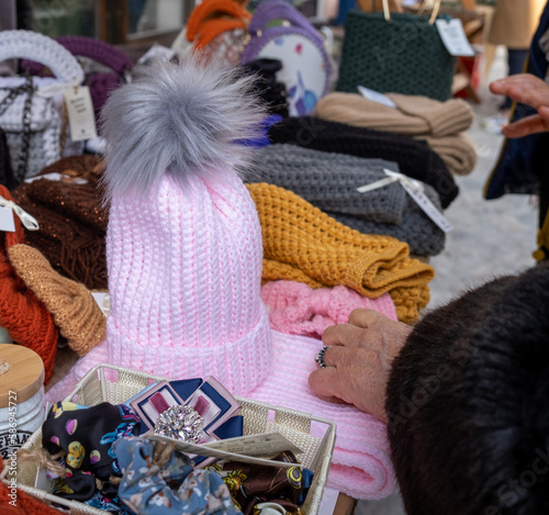 A person is looking at a pink hat with - About December 2022, Bar, Montenegro