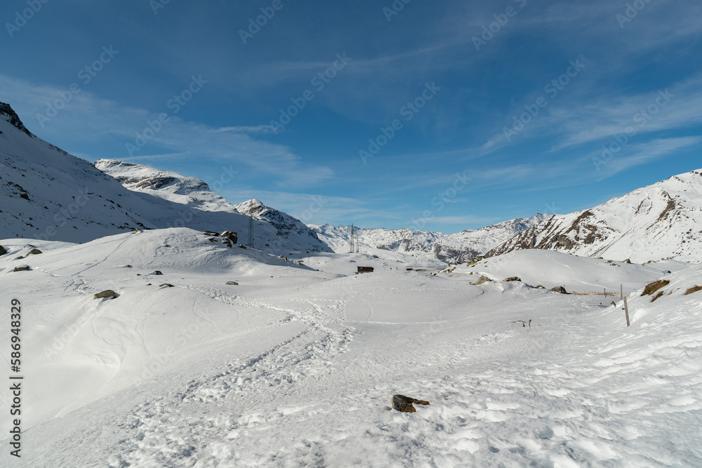 Snow covered mountain panorama on the Julier pass in Switzerland Snow covered mountain panorama on the Julier pass in Switzerland