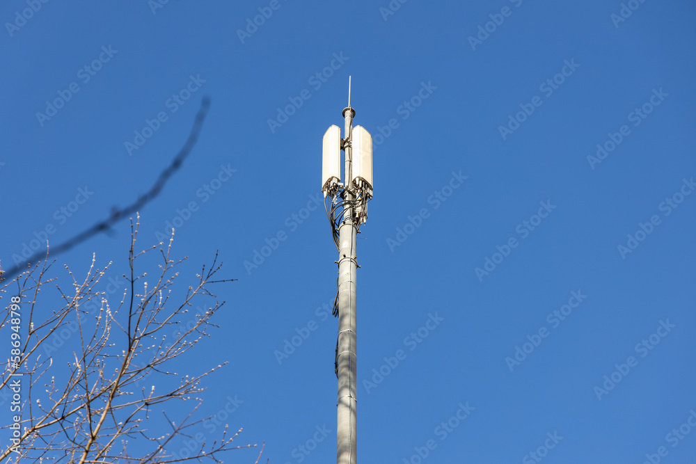 Close up of antenna repeater tower on blue sky Close up of antenna repeater tower on blue sky