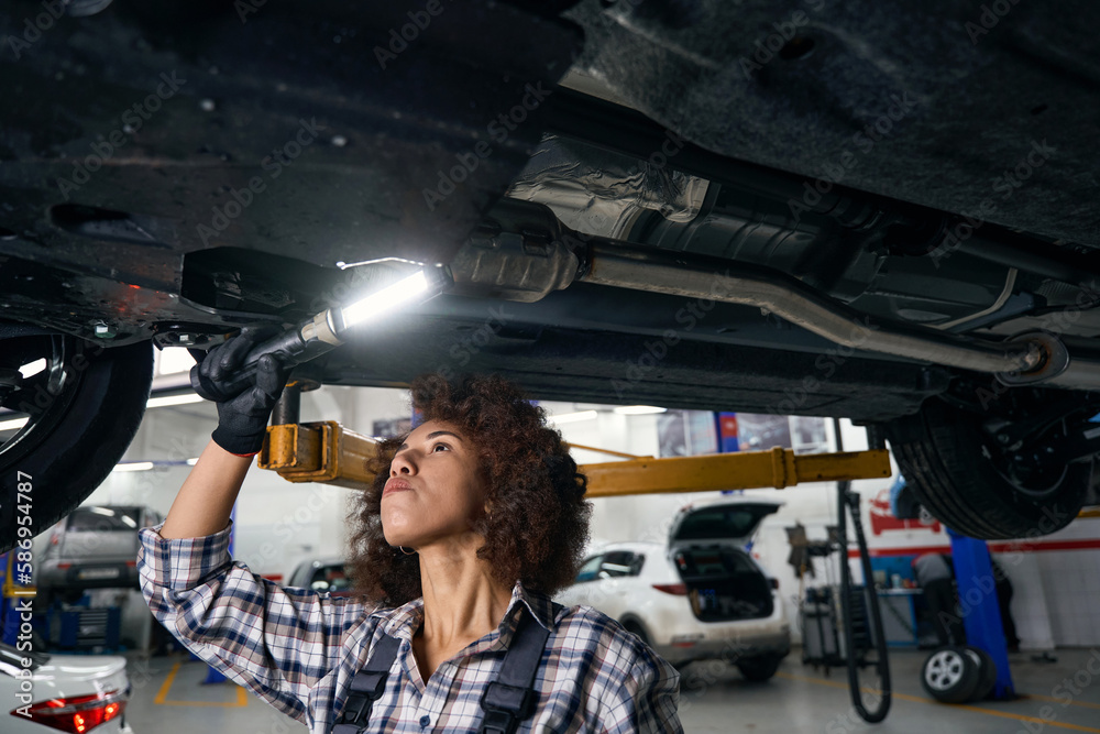 Service maintenance of a car in a modern car workshop Service maintenance of a car in a modern car workshop