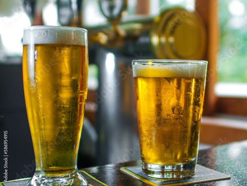 .Chopp tulip being taken and served very cold in a pub photo