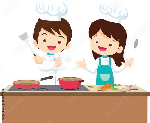 Cute chef Kids Boy and Girl cooking in the kitchen. little chef presenting.
