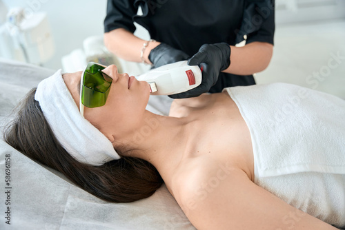 Pretty woman on laser hair removal procedure