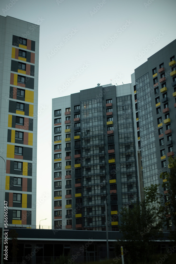 Tall building in city. New housing in area. Details of urban development. Tall building in city. New housing in area. Details of urban development.