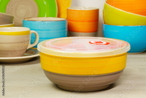 Set of colored ceramic dishware front view