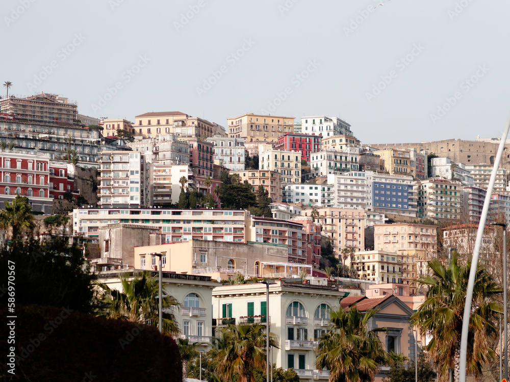 Exterior buildings architecture on the Via Caracciolo ( Lungomare di Napoli a Mergellina) promenade at the Mediterranean sea shore in Naples, Italy
