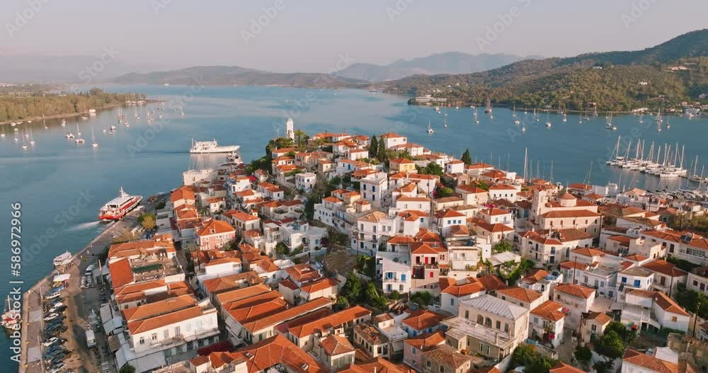 Poros island, Greece. Sailing yacht in marina at Aegean sea Aerial view