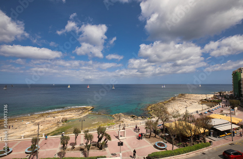 panorama view of promenade and bay in Sliema, Malta. sailingboats on the sea. summer holiday view photo