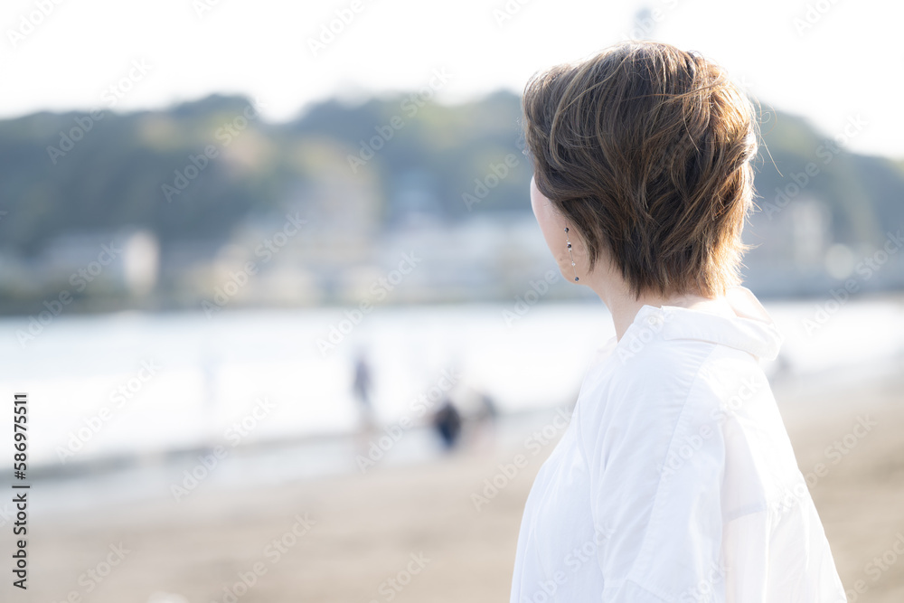 Woman looking out to sea, menopausal and other images, no face Woman looking out to sea, menopausal and other images, no face
