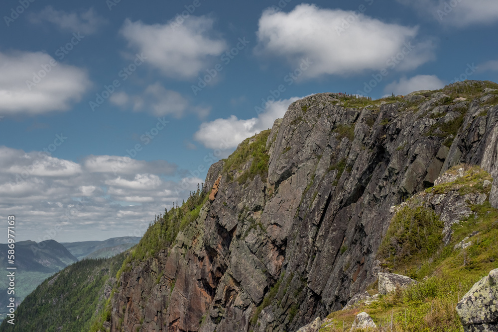Landscape in the mountains of Acropole des Draveurs, Quebec, Canada, with rocky cliff and blue sky with coulds Landscape in the mountains of Acropole des Draveurs, Quebec, Canada, with rocky cliff and blue sky with coulds