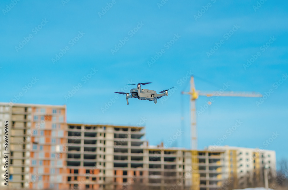 The drone flies against a blue sky. Aerial reconnaissance in Ukraine The drone flies against a blue sky. Aerial reconnaissance in Ukraine
