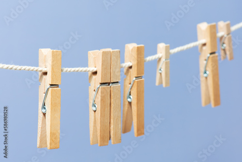 Wooden clothespin on the rope for drying clothes