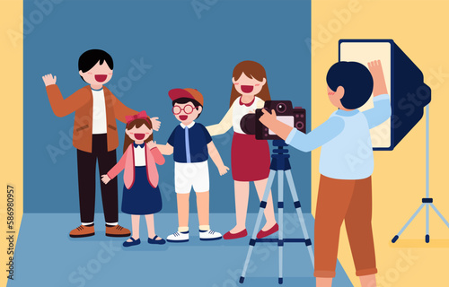 photographer man working at photographic studio and photographing family client