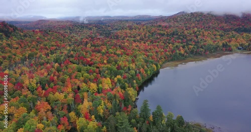 Connery Pond is seen through the fog and clouds near Whiteface Mountain in Adirondack Park, New York in fall. photo