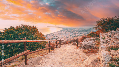 Terracina, Italy. Road To Temple Of Jupiter Anxur And Top View Skyline Cityscape City In Sunset Or Sunrise. Amazing Bright Sky. photo