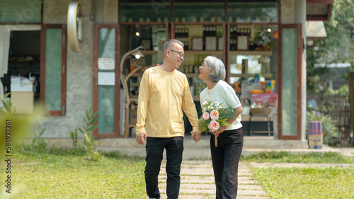 Elderly couple. Asian couple giving love to each other smiling happily.