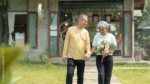 Elderly couple. Asian couple giving love to each other smiling happily.