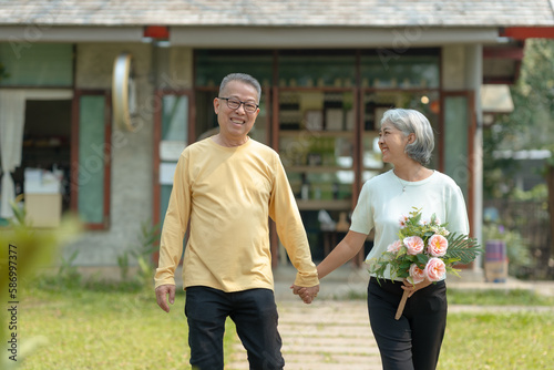 Elderly couple. Asian couple giving love to each other smiling happily. © amnaj