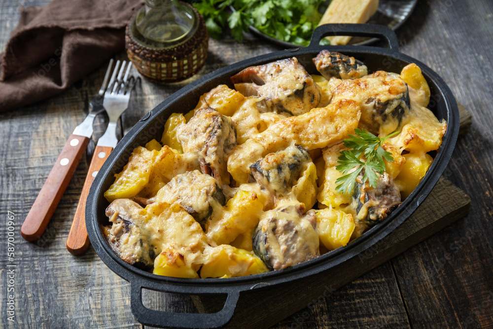 Fish casserole mackerel, potato with cheese and creamy sauce. Greek food.