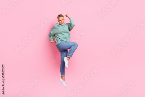 Photo of positive joyful lady wear trendy outfit rejoice win blogger award empty space isolated on pink color background
