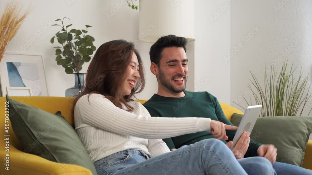 Happy couple using tablet together Happy couple using tablet together