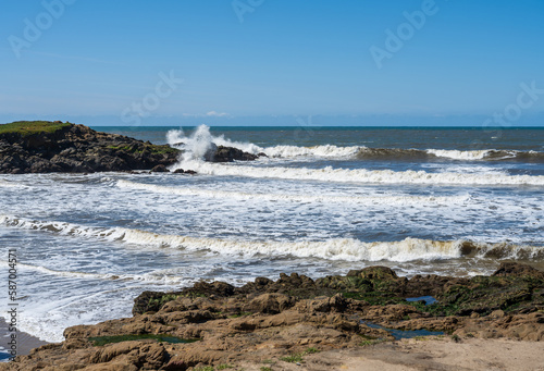 Waves breaking along the California coastline