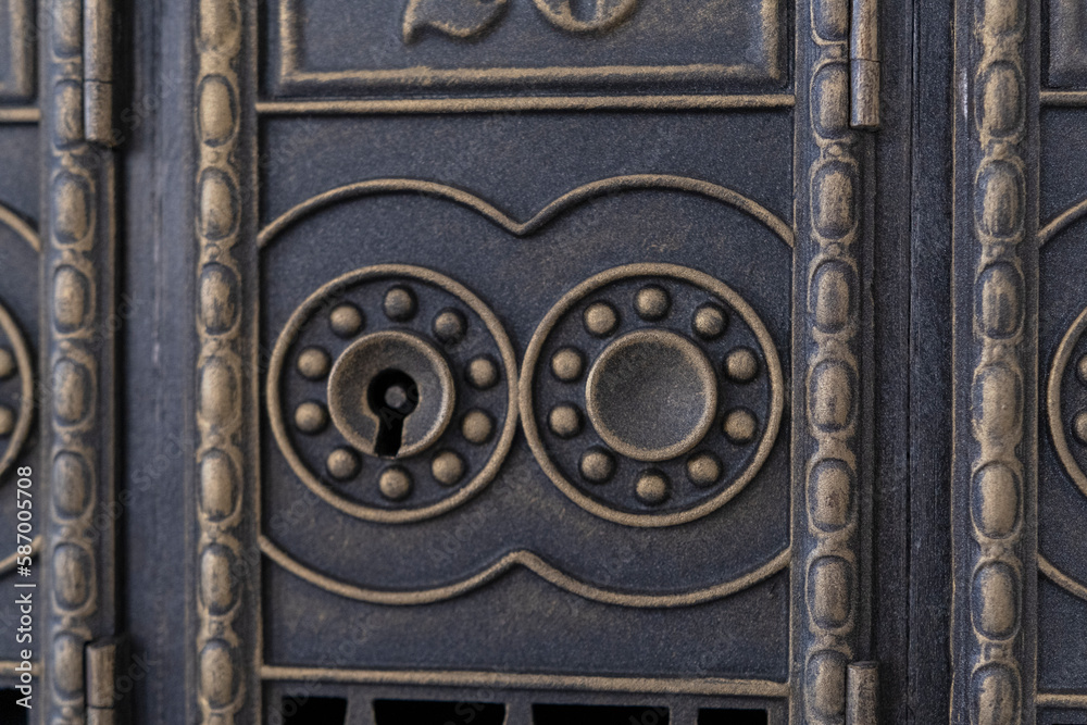 Antique keyhole on metal door. Old retro keyhole close up. Ancient lock of an old portal.