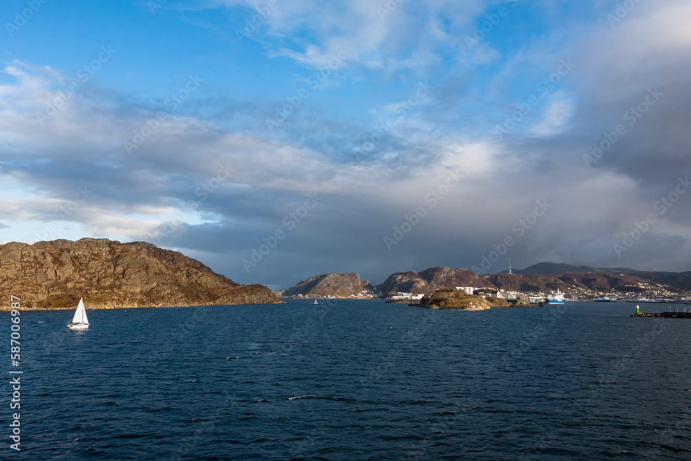 A sailing yacht entering Bodø harbour, Nordland, Norway