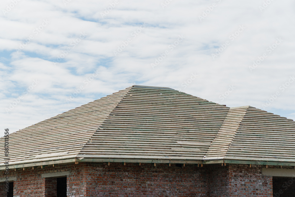 Construction of a new house. New house roof structure. New roof covering Construction of a new house. New house roof structure. New roof covering
