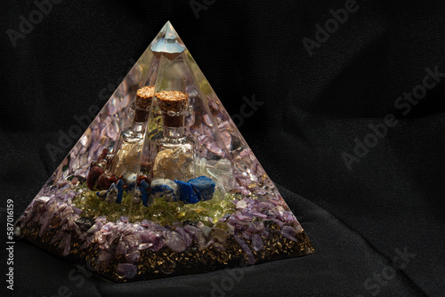 Large orgonite with silver bottle. photo