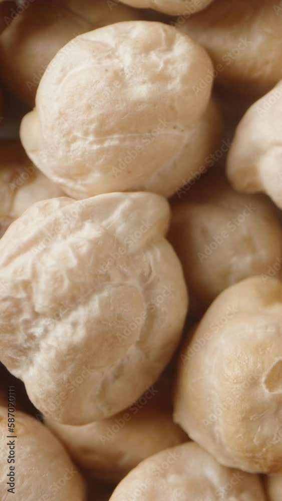 A big pile of Chickpeas . View from above. Dolly slider extreme close-up. Vertical video Social Media A big pile of Chickpeas . View from above. Dolly slider extreme close-up. Vertical video Social Media