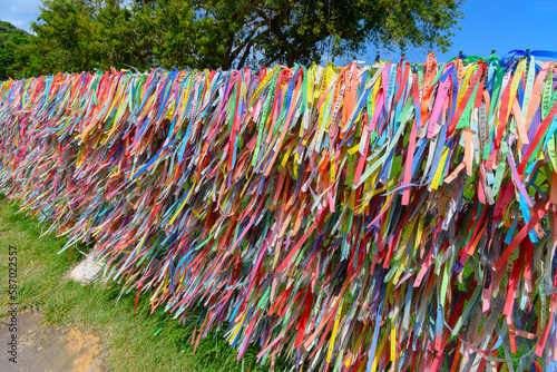 Colored ribbons tied to a fence, souvenir of those who visit Porto Seguro - Bahia, Brazil.