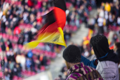 people with German national flag at a soccer game in the stadion