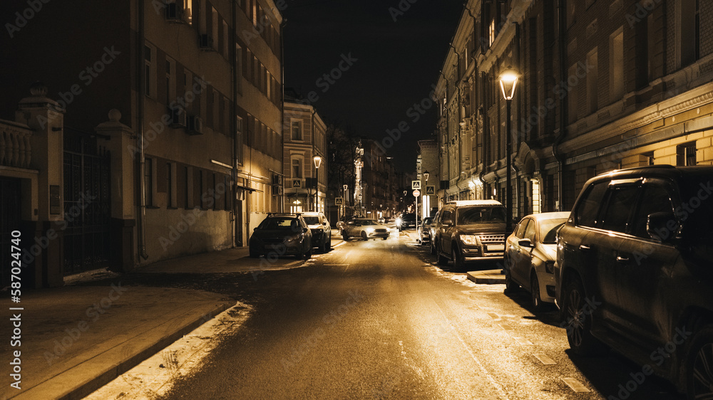 Dark street in the city at night in winter