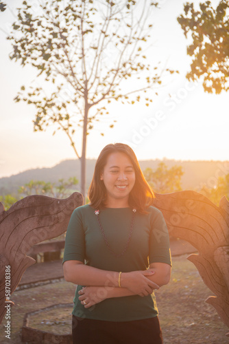 asian women is smile on the sunset.