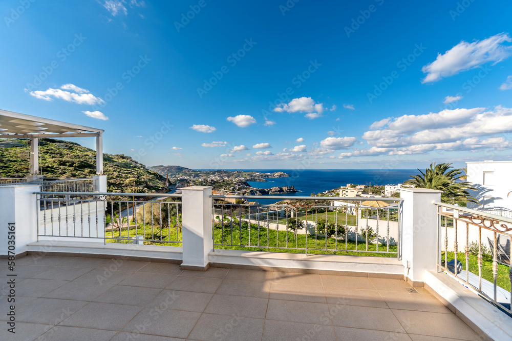 Panoramic sea view from a terrace or veranda. Summer day, blue sky ans sea. 