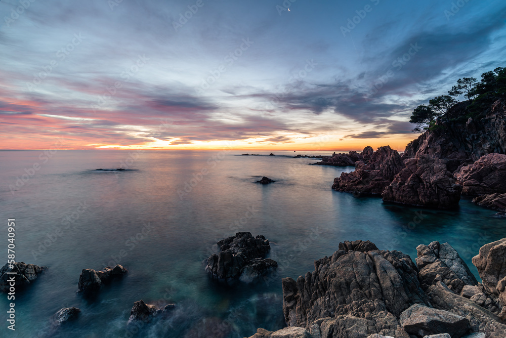 Magic sunrise at the rocky coastline of the sea. Magic sunrise at the rocky coastline of the sea.