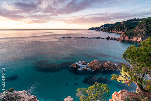 Sunrise at the coastline of the Mediterranean Sea (Esculls de Canyet, Spain)