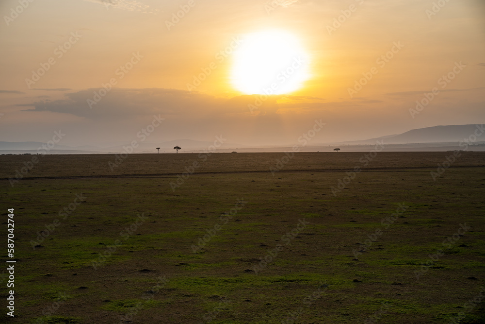 Aerial view of a morning sunrise above the Masai Mara Reserve in Kenya, Africa Aerial view of a morning sunrise above the Masai Mara Reserve in Kenya, Africa
