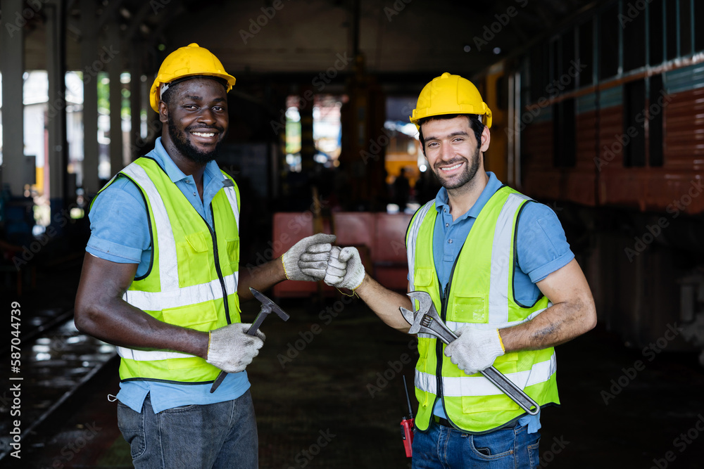 Factory engineers discussing and shaking hands with a business cooperation agreement. in heavy industrial production plants Factory engineers discussing and shaking hands with a business cooperation agreement. in heavy industrial production plants